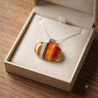 Ember fused glass pendant presented in a Stoney Lake Glassworks gift box