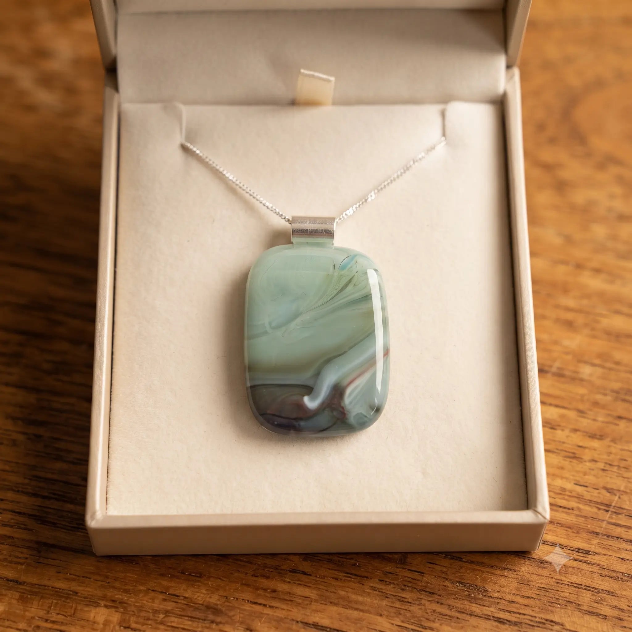 Meadow Mist fused glass pendant presented in a Stoney Lake Glassworks gift box
